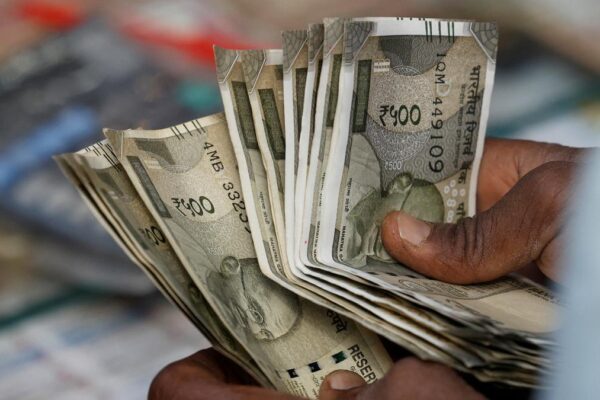 Rupee slumps 52 paise to close at 87.43 against U.S. dollar